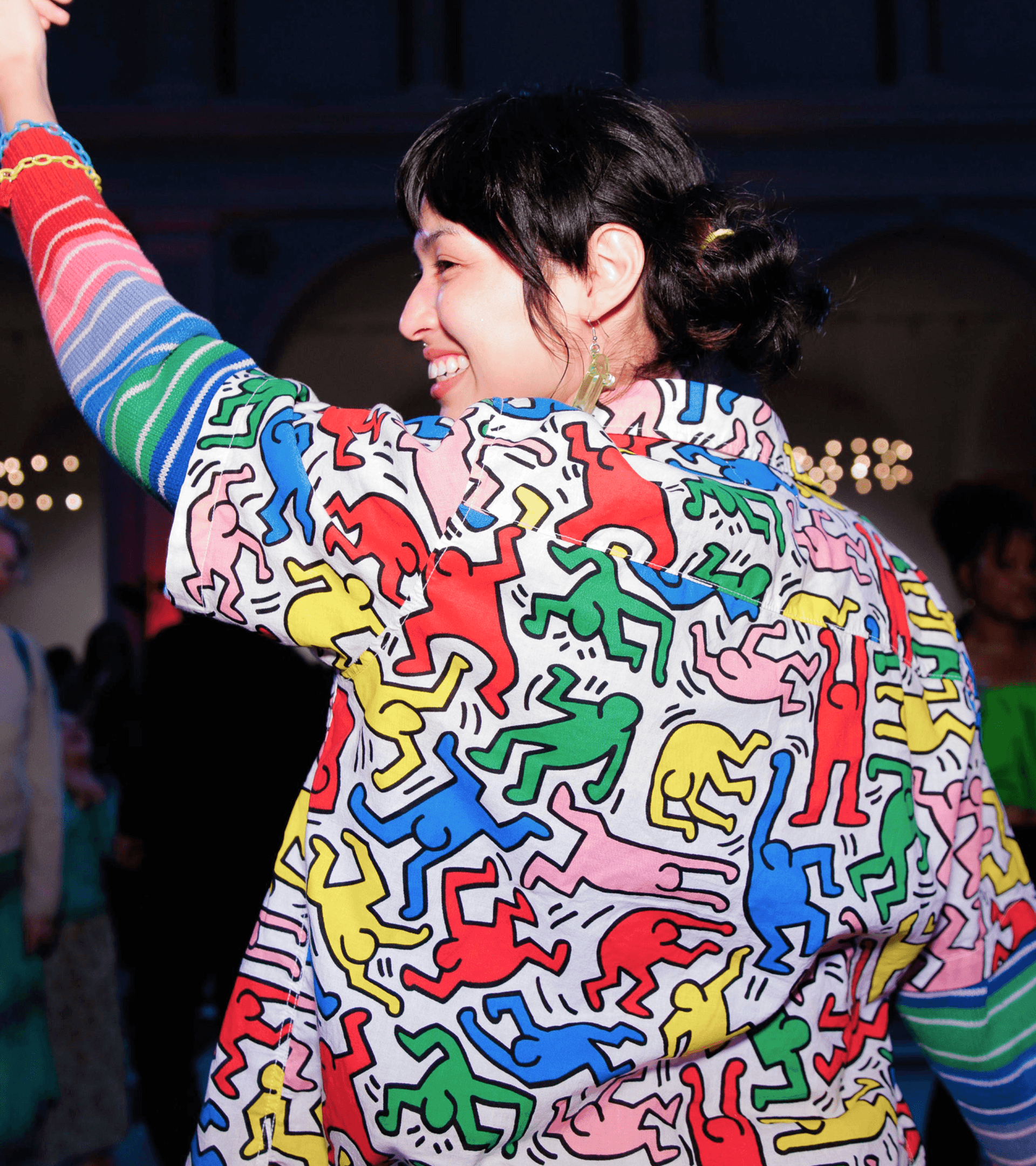 A photo of an event attendee dancing.