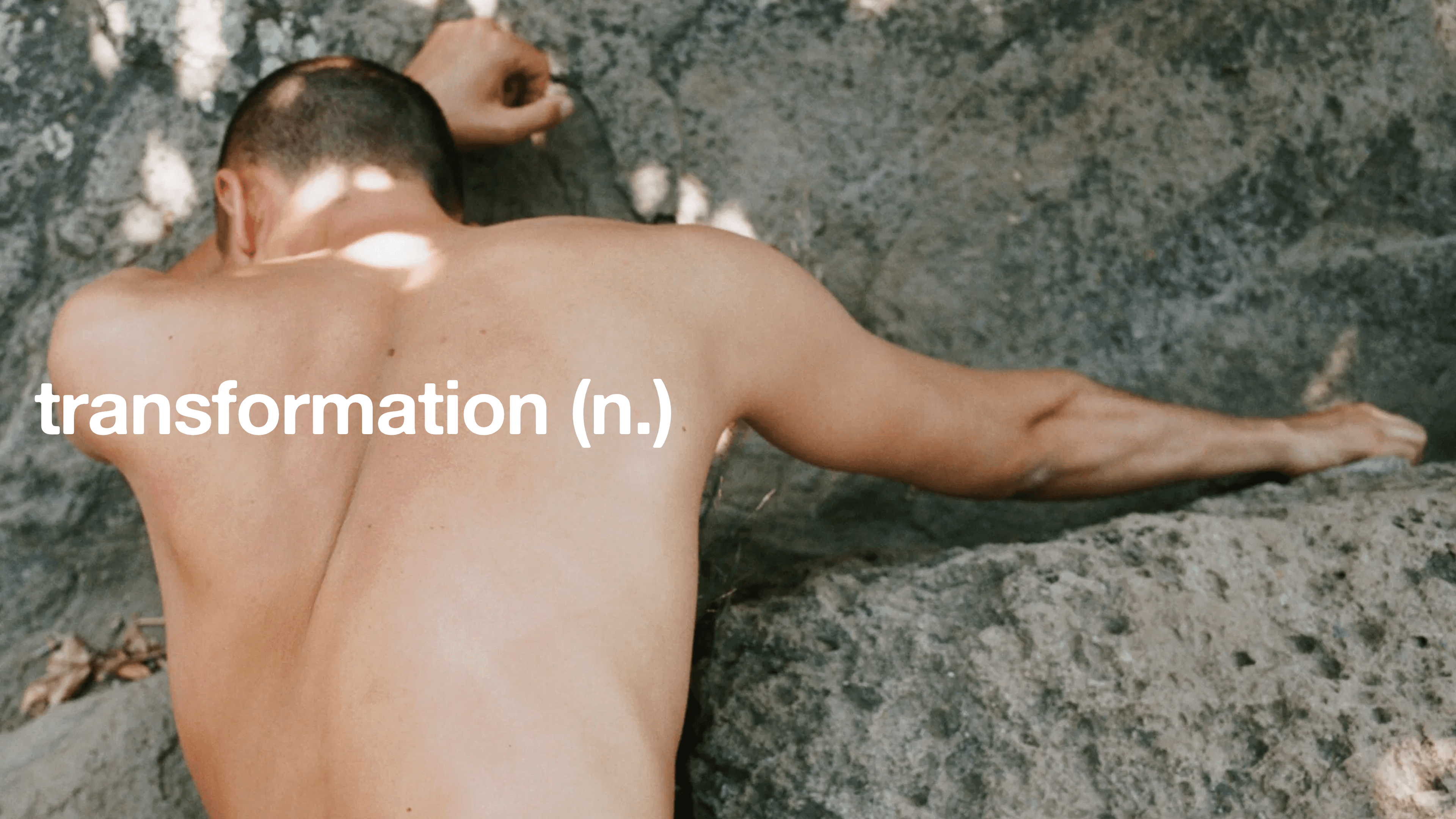 A person seen from behind embraces the natural surroundings, with overlaid text reading "transformation, noun".