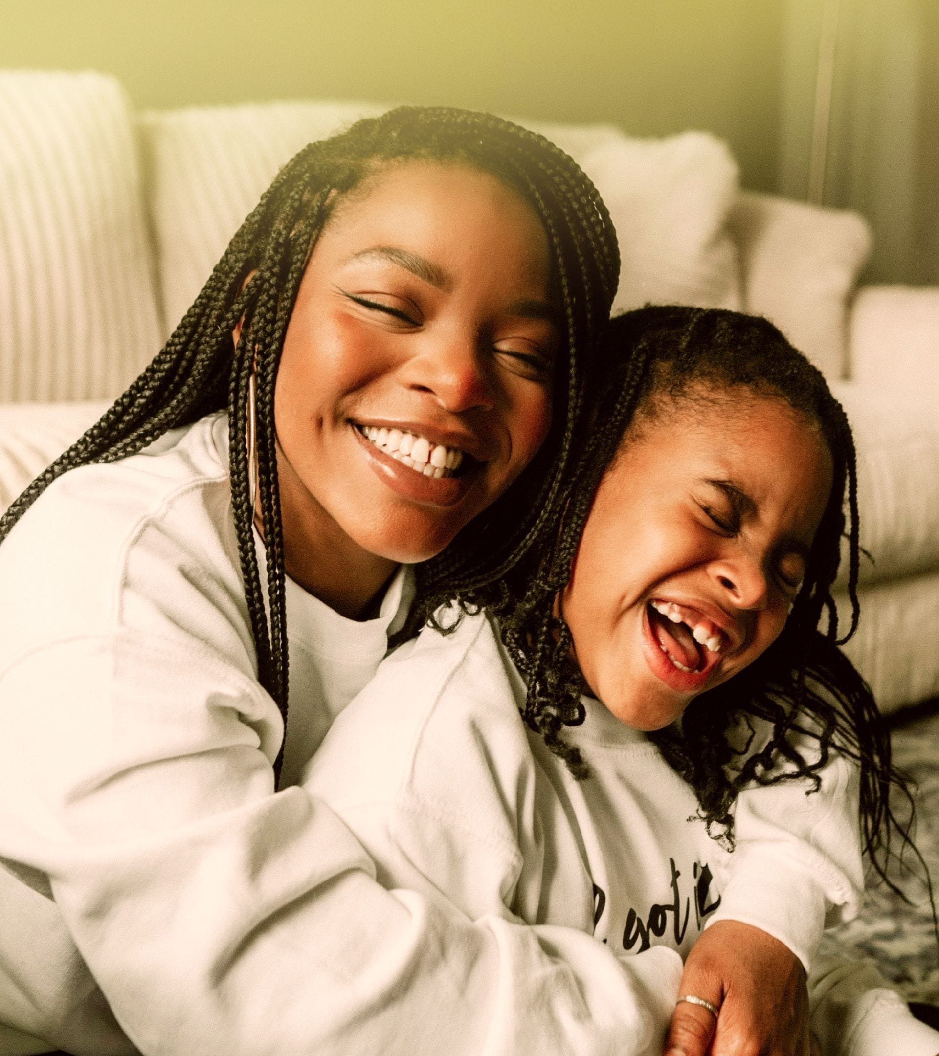 Two smiling people with a soft glow, showing photography art direction