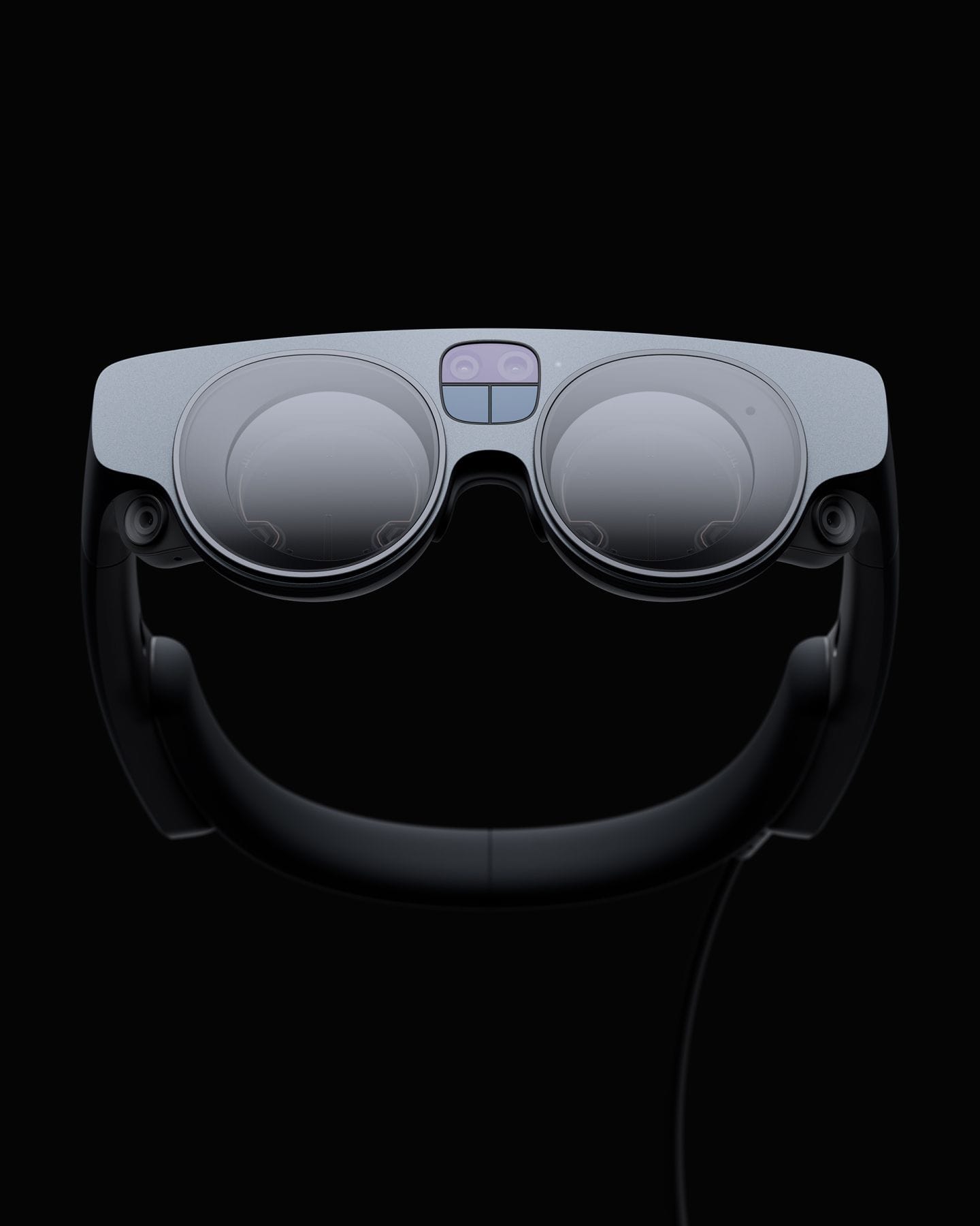 A render of the Magic Leap headset, showing the front optical panel and sensors and a black band receeding in the background.