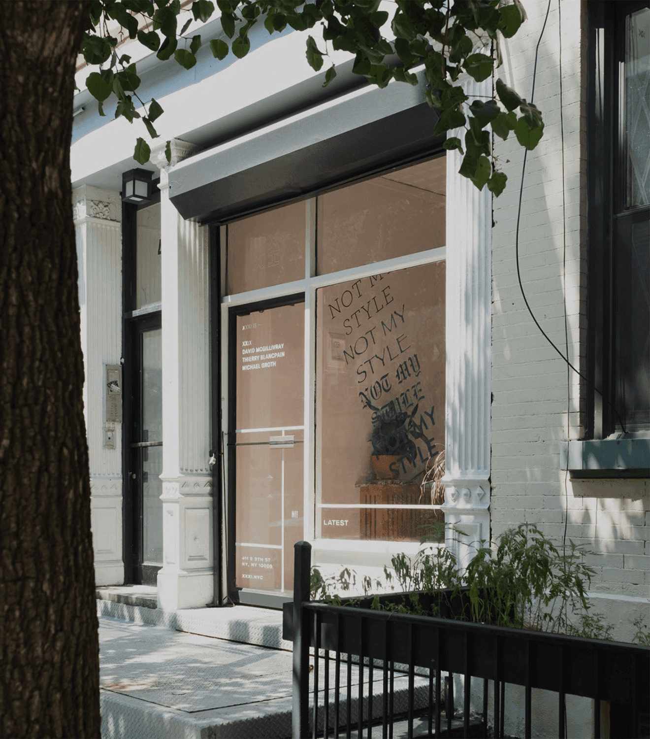 Cover for XXXI showing the former storefront