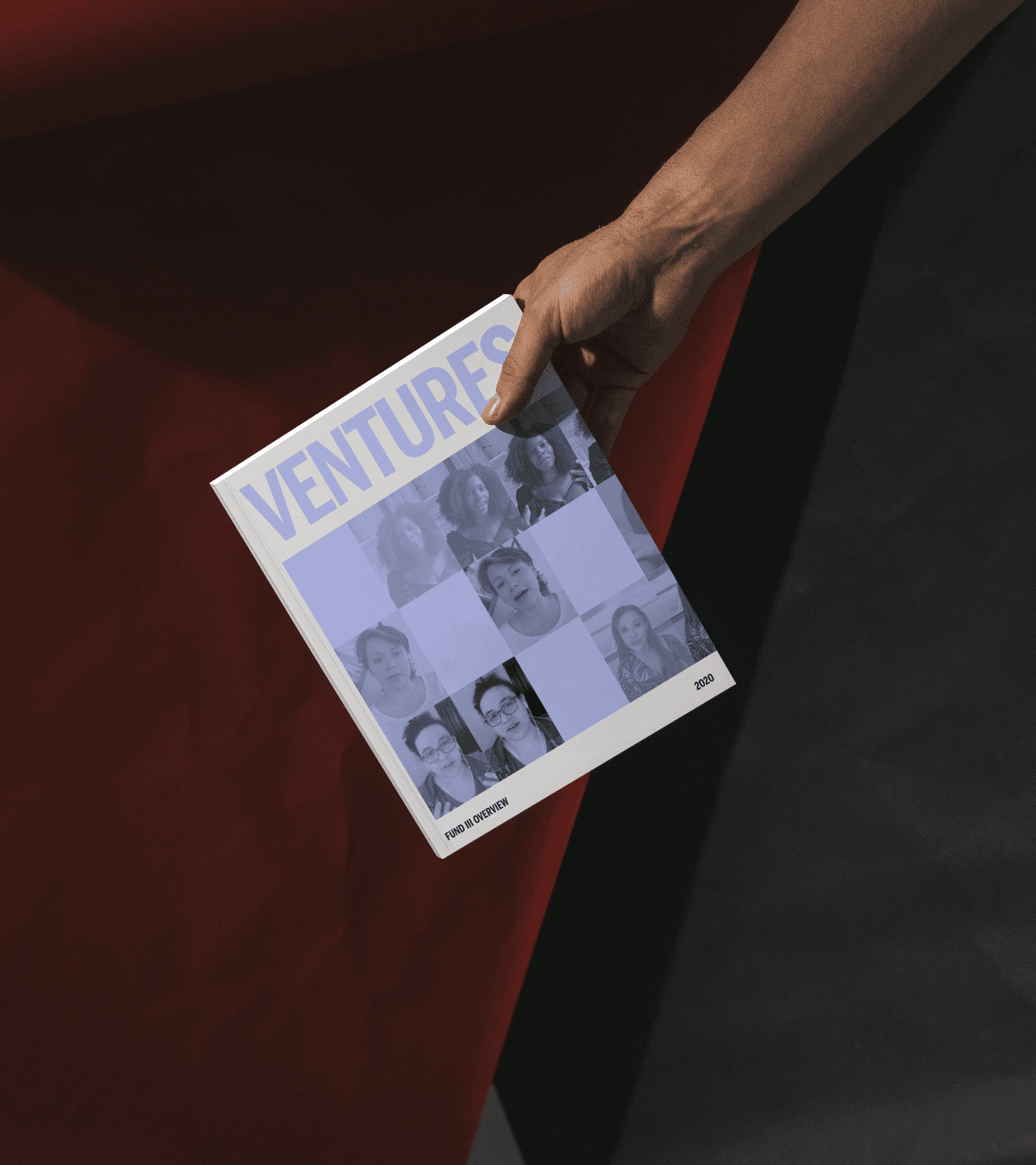 Hand holding a BBGV ‘Ventures’ book showing a portrait grid of founders on the cover.