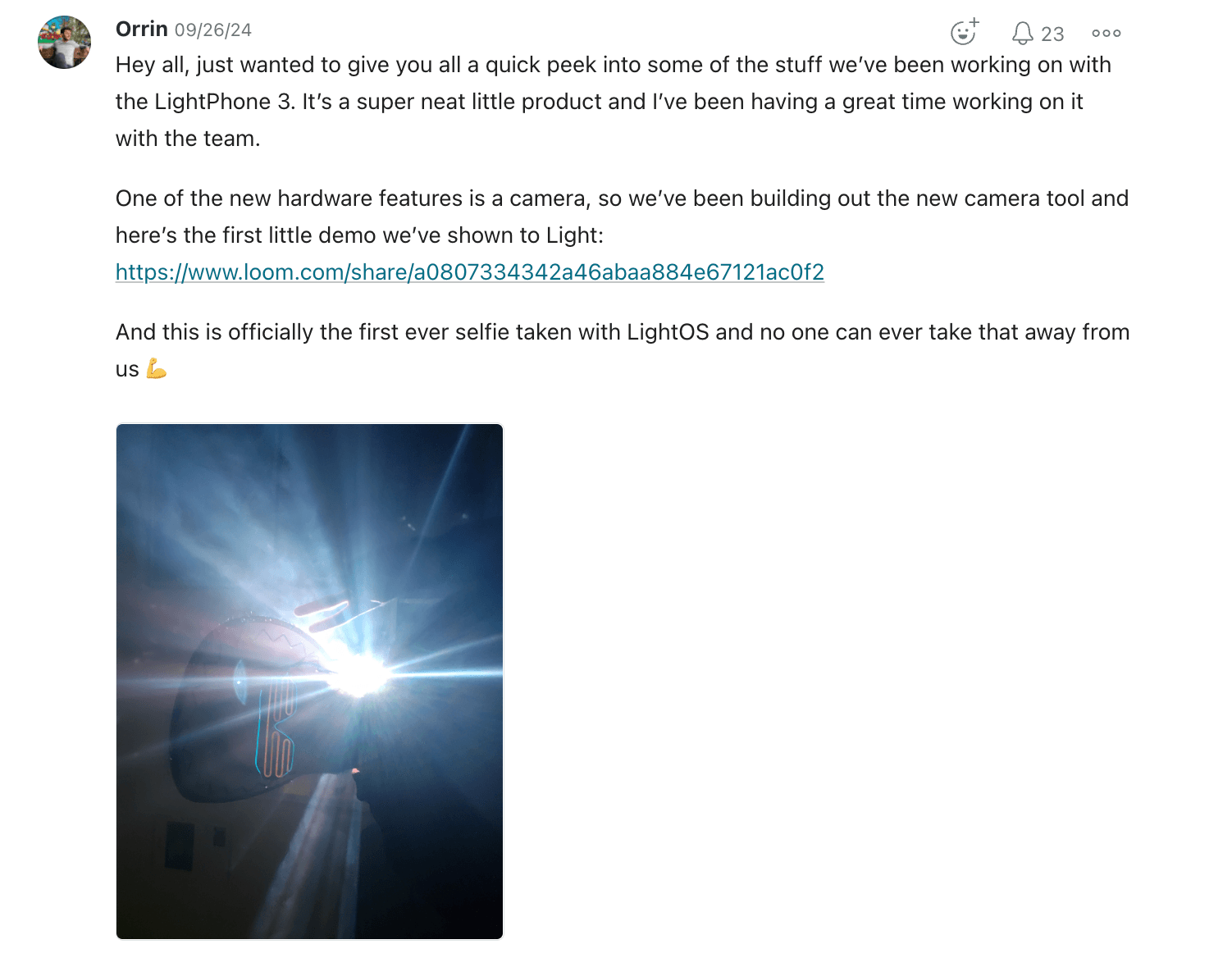Internal Slack-style post sharing the first photo and selfie taken with the new Light Phone III camera.
