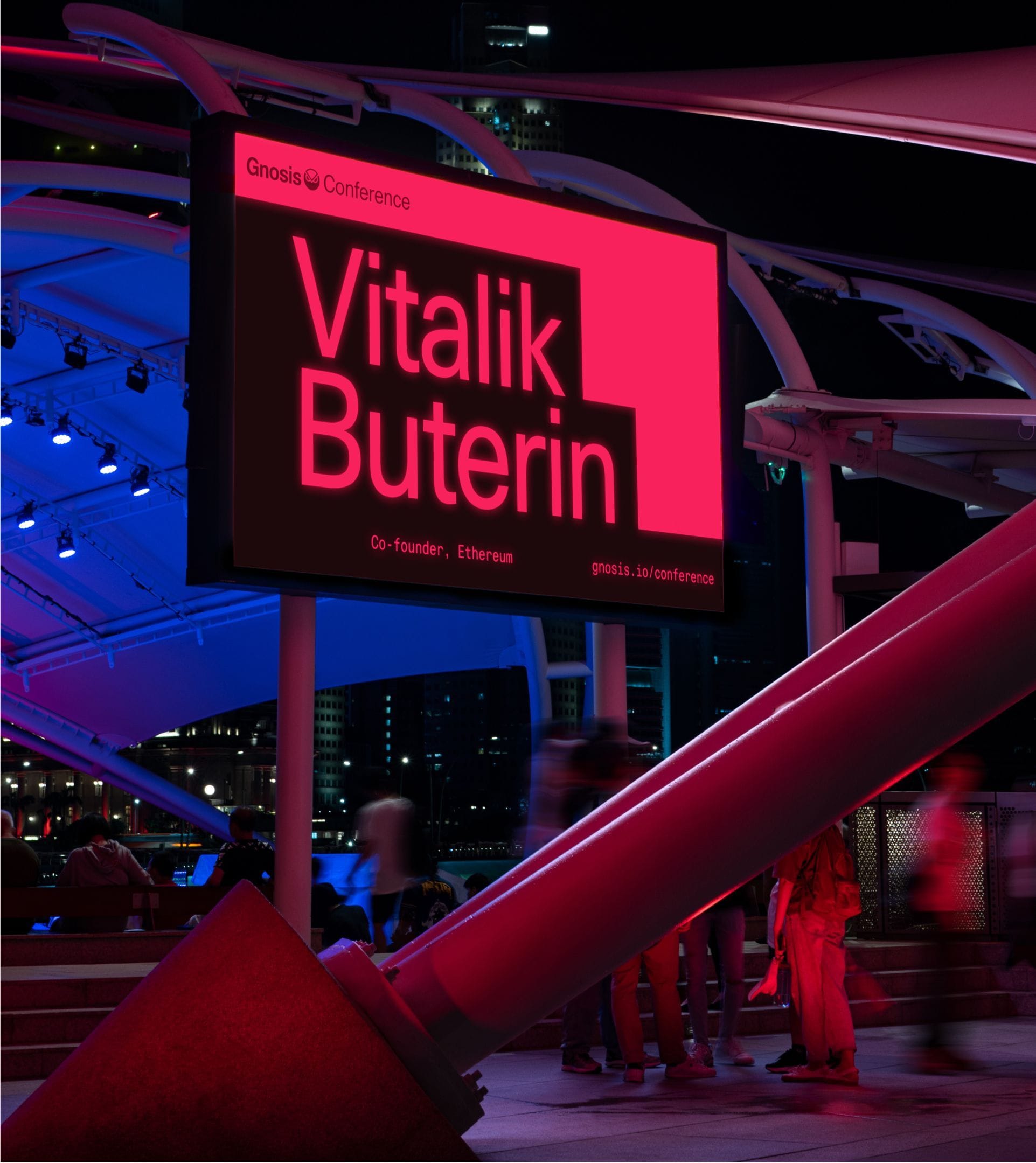 Gnosis Conference outdoor LED screen displaying Vitalik Buterin as a featured speaker.
