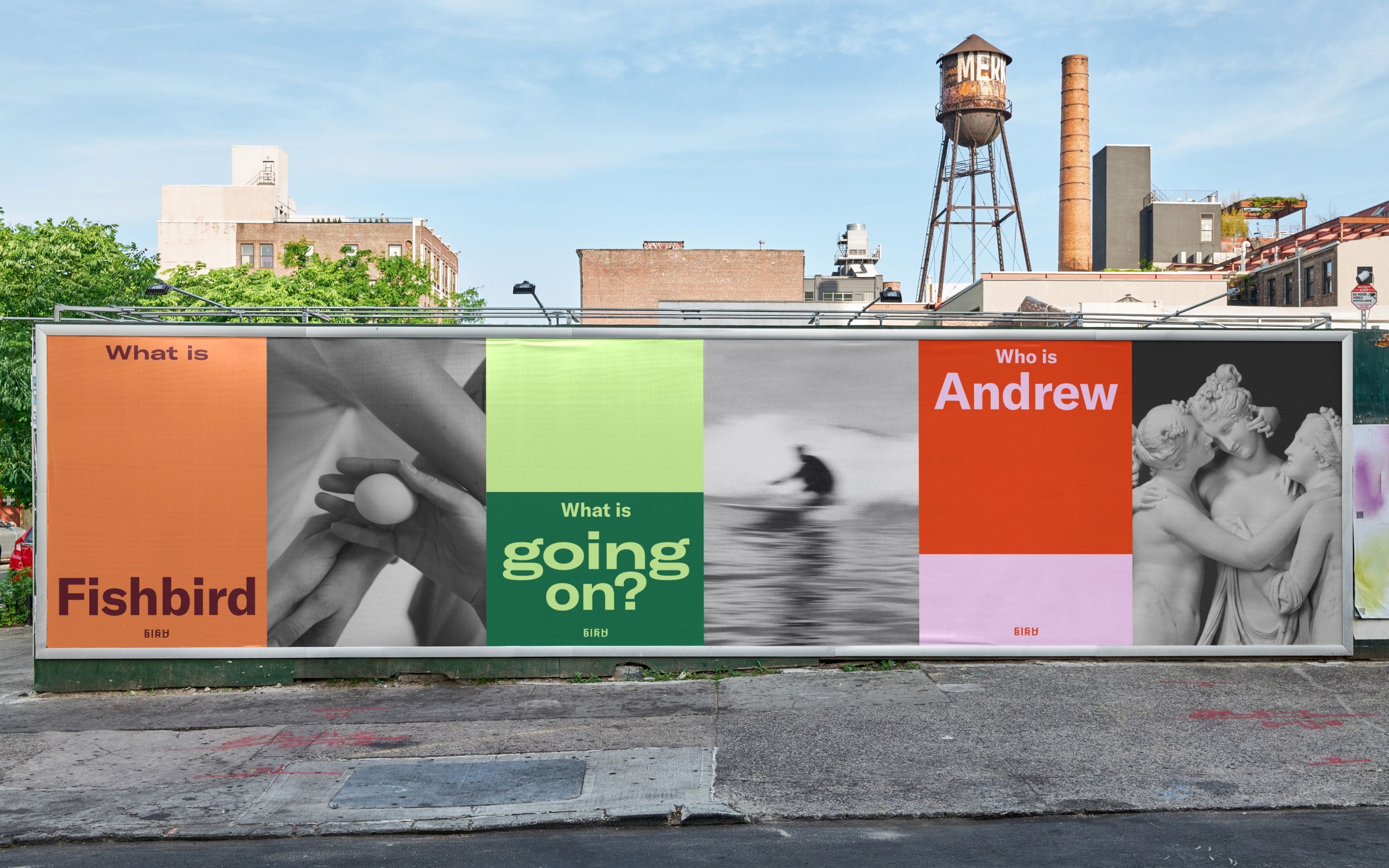 Mockup of a Fishbird billboard pasted on a Brooklyn warehouse wall with question prompts including ‘What is Fishbird’, ‘What is going on?’, and ‘Who is Andrew’.
